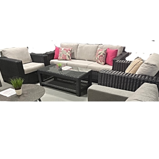 Introducing the Trillium Outdoor Sofa Set at Patio and Spa—a highly sought-after gem that seldom remains on the showroom floor!  The espresso shade of  thick hand woven outdoor wicker/resin on the outdoor sofa and two club chairs have an amazing contrast with light grey Sunbrella Cushions and will captures the eye of everyone who encounters it.  Large armrests allow for placement of a drink or plate.  The set comes complete with a coffee table.